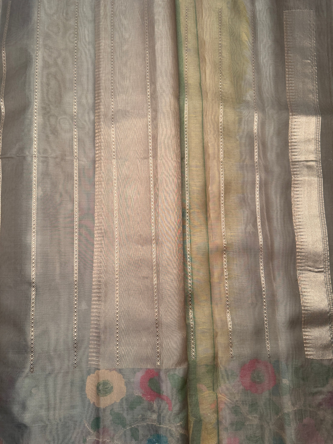Folded display of The Vrindavan Kora Jamdani saree highlighting fine weave