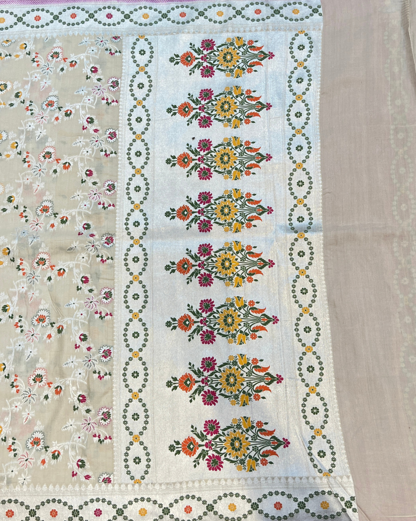 Intricate Meenakari pallu on soft ivory handloom Georgette saree