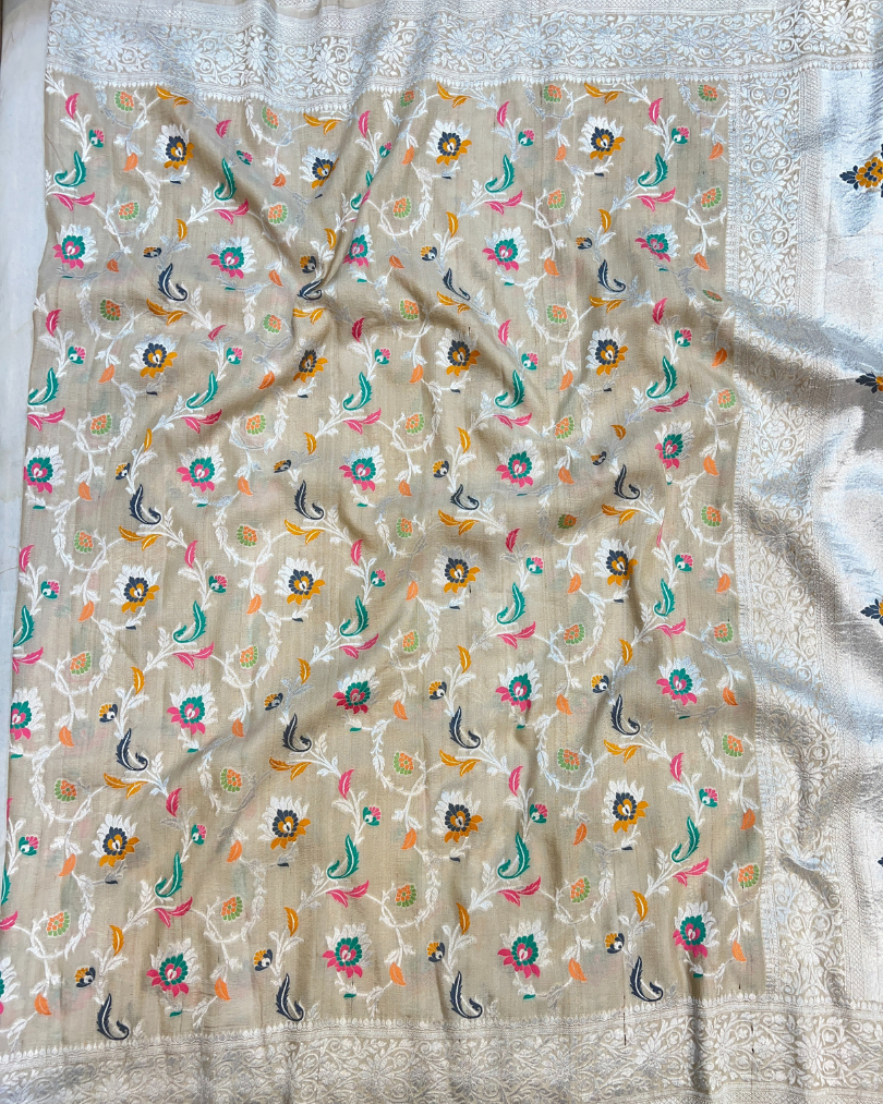 Close-up of handwoven Tilfi Meenakari floral jaal on ash white tissue fabric