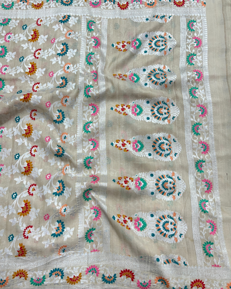 Handwoven silver zari pallu on ash white tissue Georgette saree
