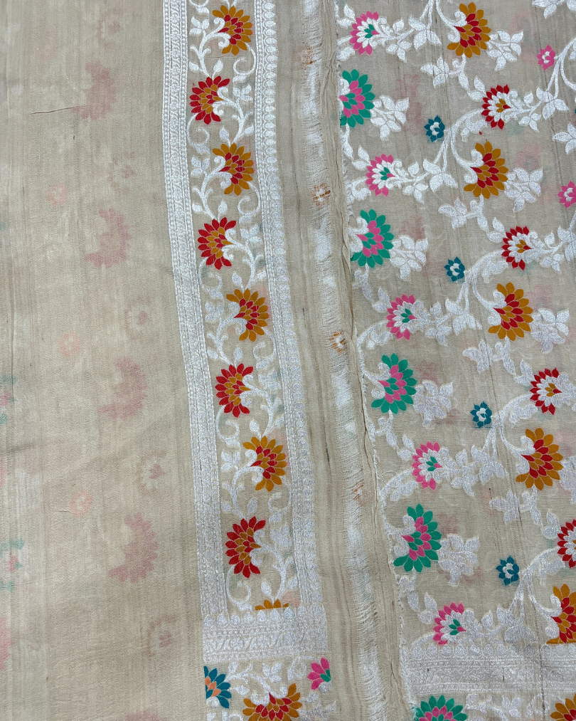 Graceful drape of ash white tissue Tussar Georgette Tilfi saree