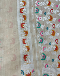 Graceful drape of ash white tissue Tussar Georgette Tilfi saree