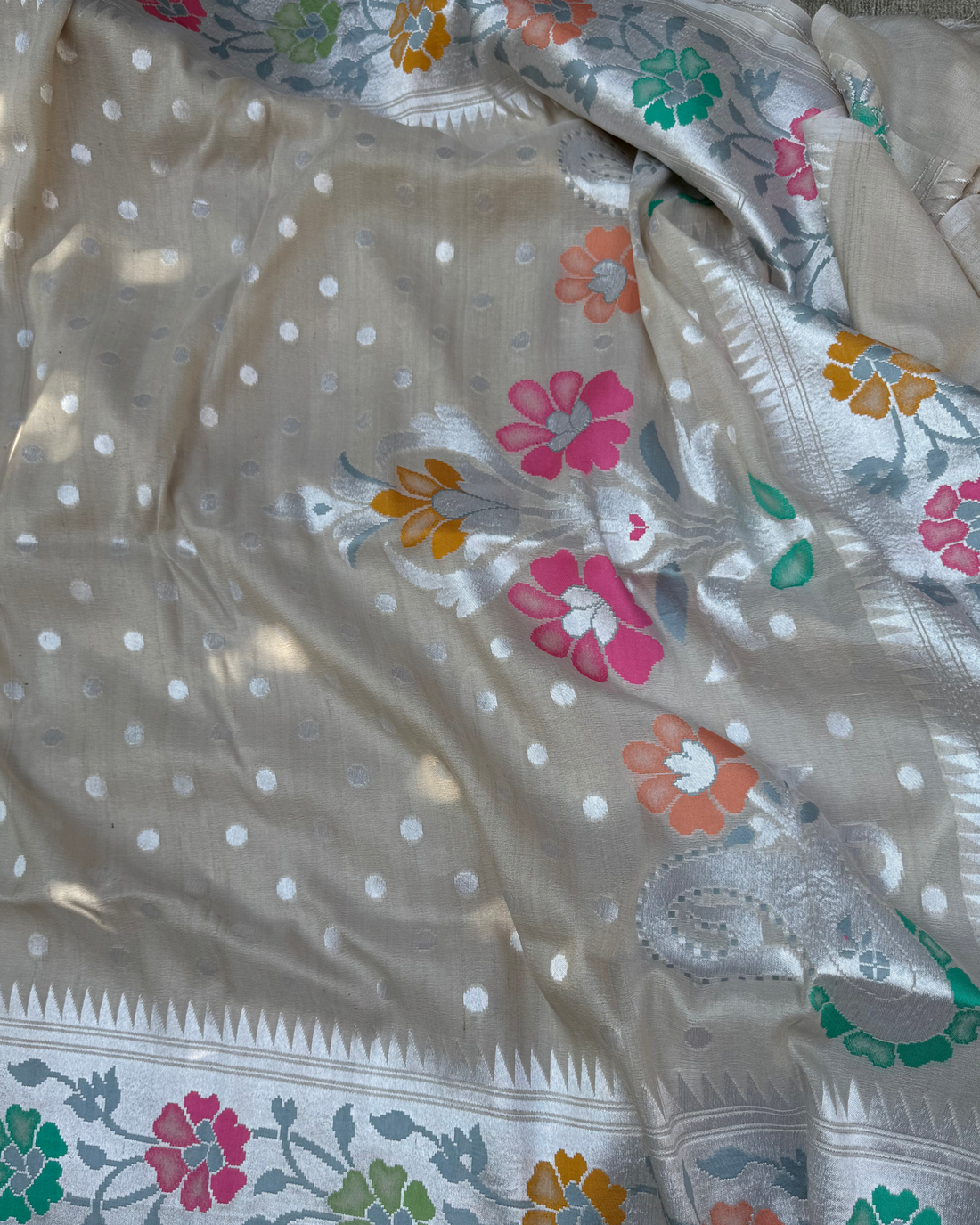 Close-up of refined zari motifs on ash white Tussar Georgette handloom silk