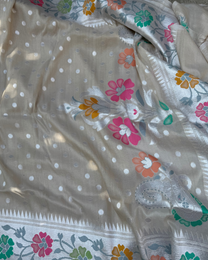 Close-up of refined zari motifs on ash white Tussar Georgette handloom silk