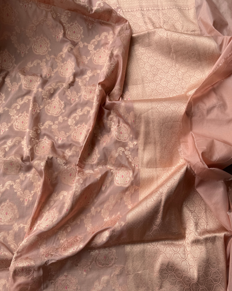 Handwoven Kadhua floral motif detail on dusty peach pure Katan silk saree