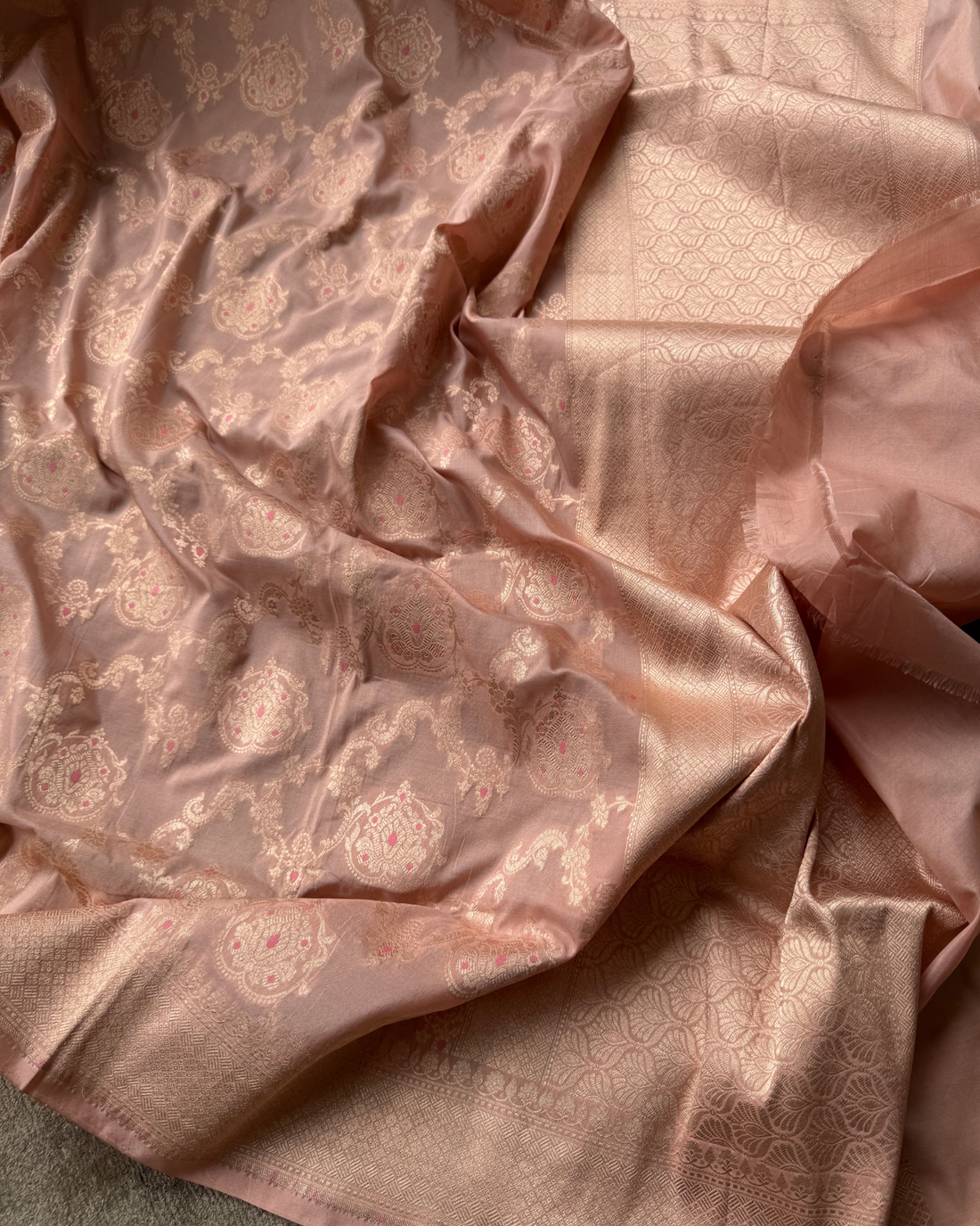 Pallu composition and minimal border on dusty peach pure Katan silk saree
