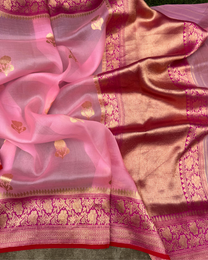 Close-up of handwoven Kadwa golden motifs on pure pink Kora silk