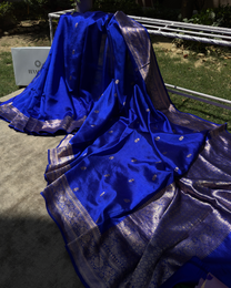 Draped pleats view highlighting soft silk luster of dark blue Banarasi saree