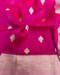 Close-up of handwoven Kadwa floral boota on red pure Kora silk Banarasi saree
