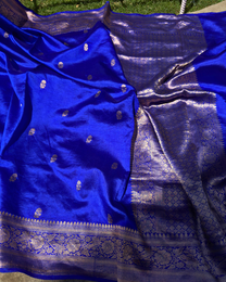Close-up of dual-tone metallic zari work on dark blue Mulberry silk saree