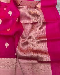 Pallu and zari border detail of red pure Kora silk Banarasi saree