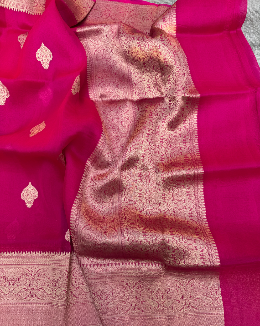 Pallu and zari border detail of red pure Kora silk Banarasi saree