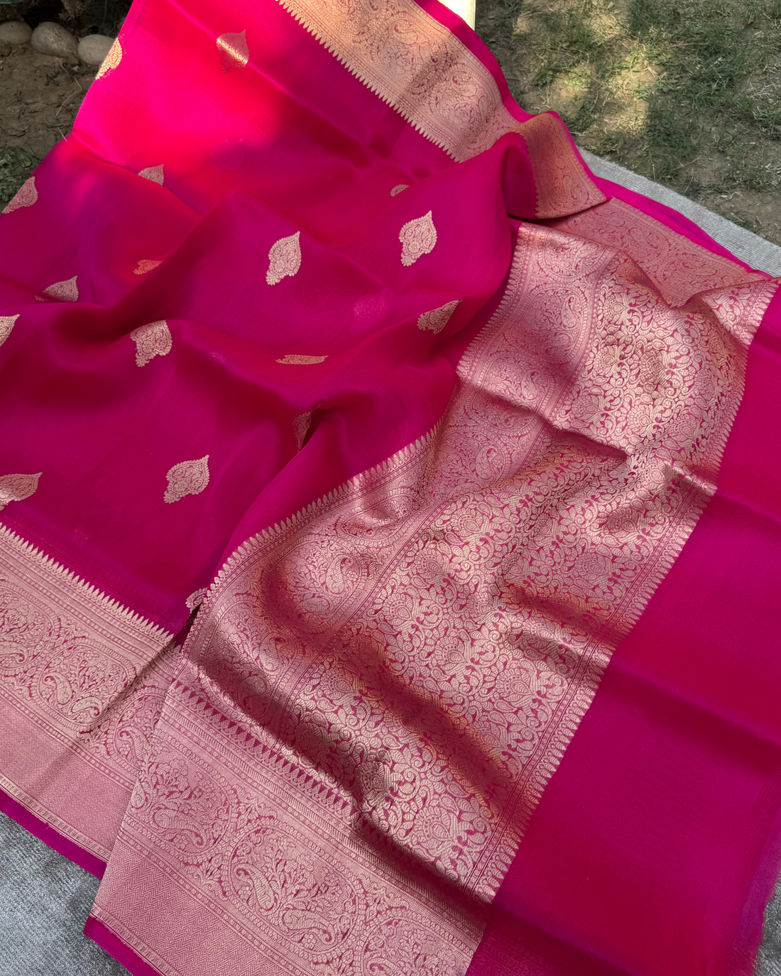 Draped pleats view of red pure Kora silk Banarasi handloom saree
