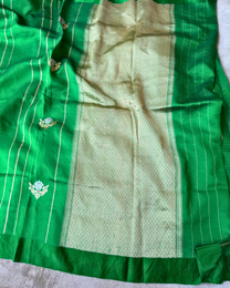 Traditional border on green pure Mulberry soft silk saree