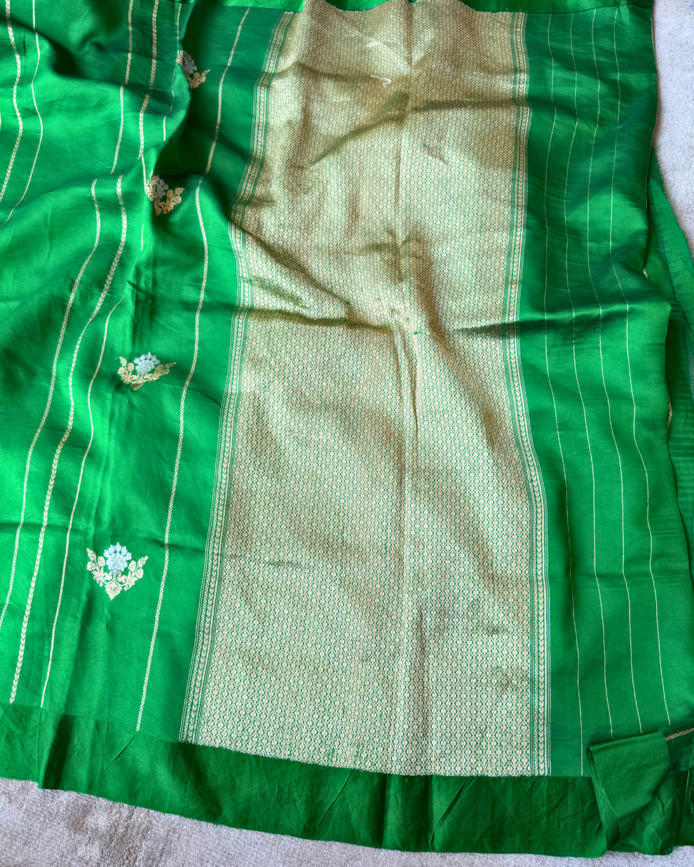 Traditional border on green pure Mulberry soft silk saree