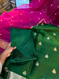Contrasting green kurta and rani pink dupatta fabric texture flat lay