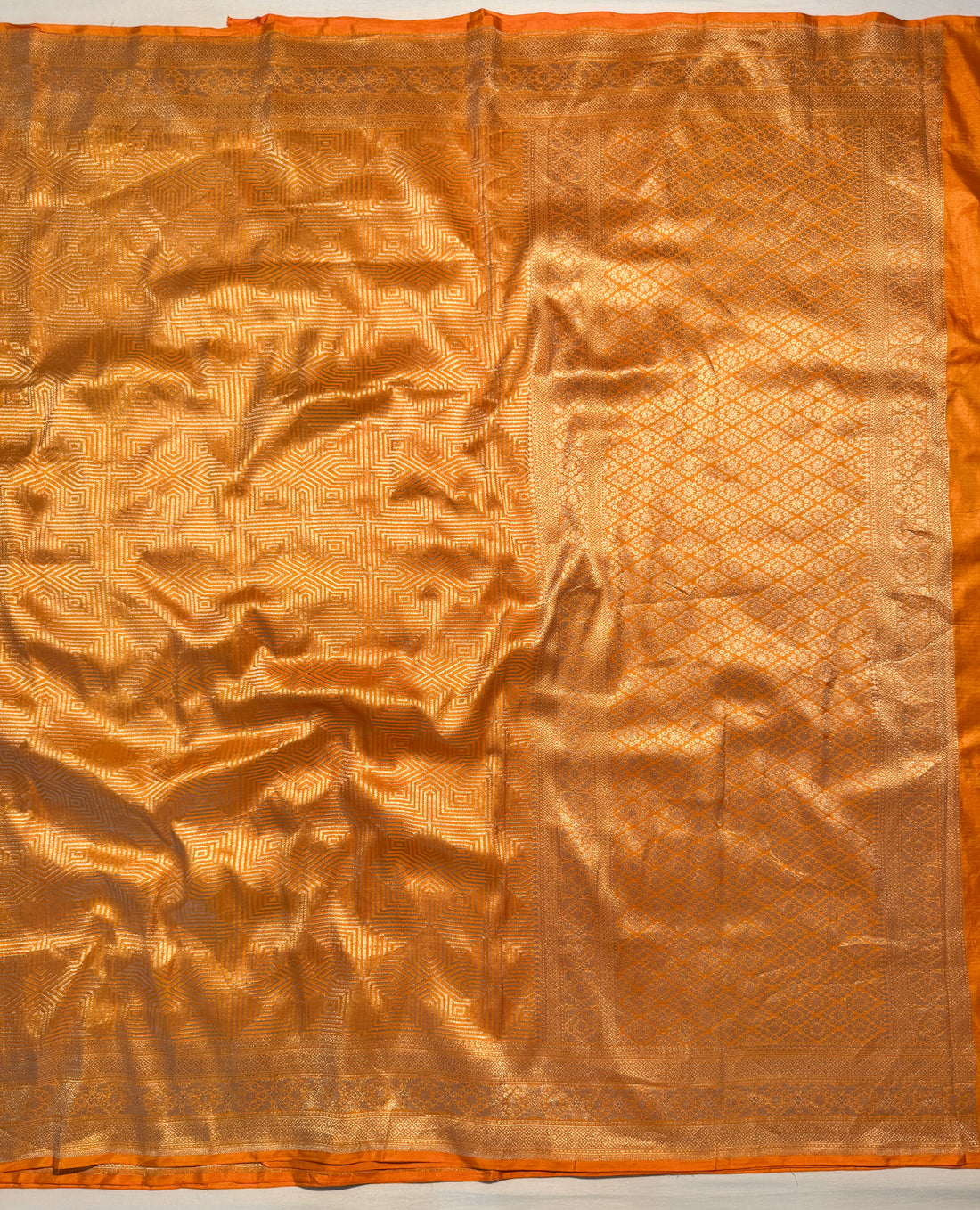 Geometric zari pattern on mustard Banarasi Katan silk saree close-up