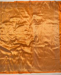 Geometric zari pattern on mustard Banarasi Katan silk saree close-up