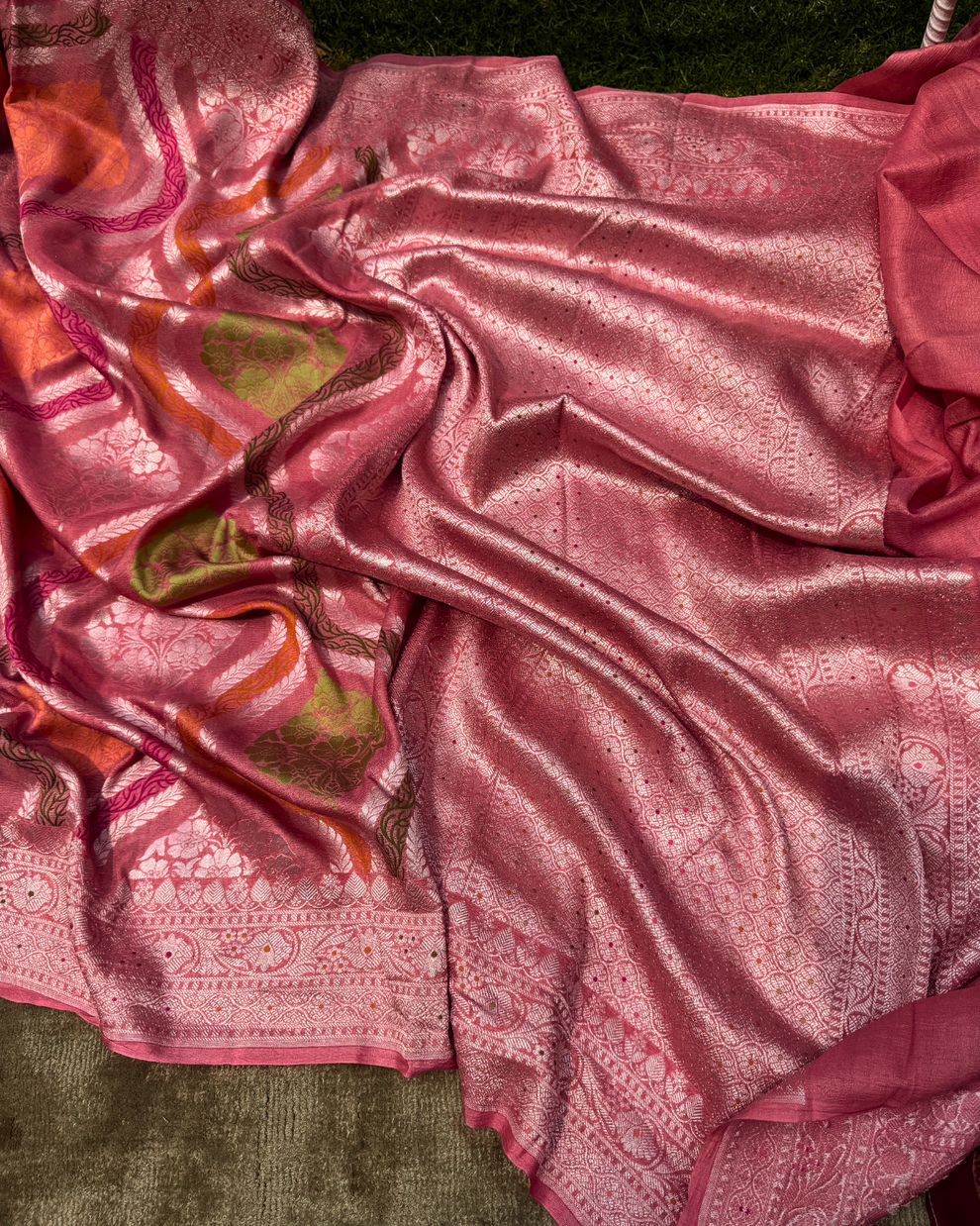 Subtly textured lightweight drape and pleats of dusty pink Banarasi saree