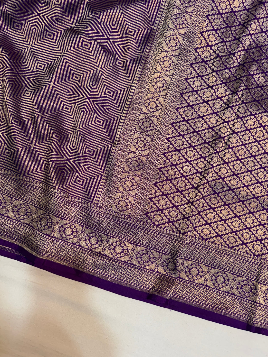 Rich geometric zari woven pallu on purple pure Katan silk Banarasi saree