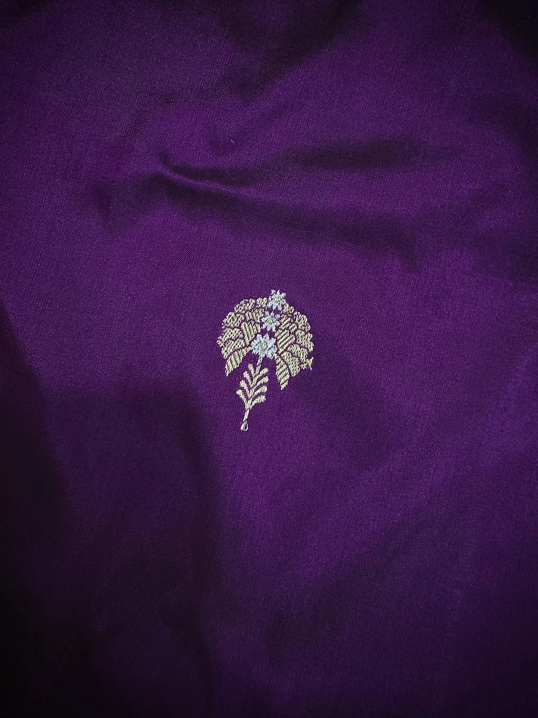 Pleats detail of royal purple handloom Kadwa Banarasi Katan silk saree