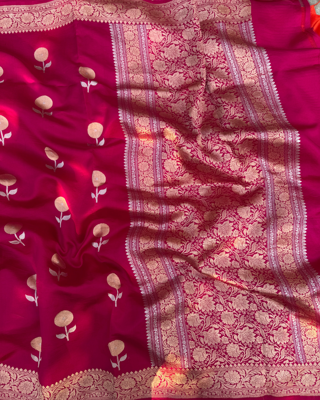 Pallu view of dark pink pure Mulberry soft silk saree with zari detailing