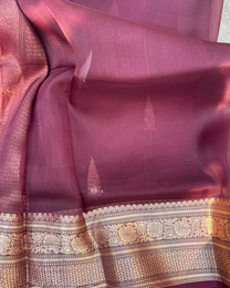 Close-up of gleaming zari Kadwa motifs on magenta pink pure Kora silk saree
