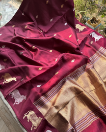 Cow motif border detailing on wine pure Mulberry soft silk saree