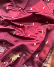 Woven pallu and cow motif border on wine pure Mulberry soft silk saree