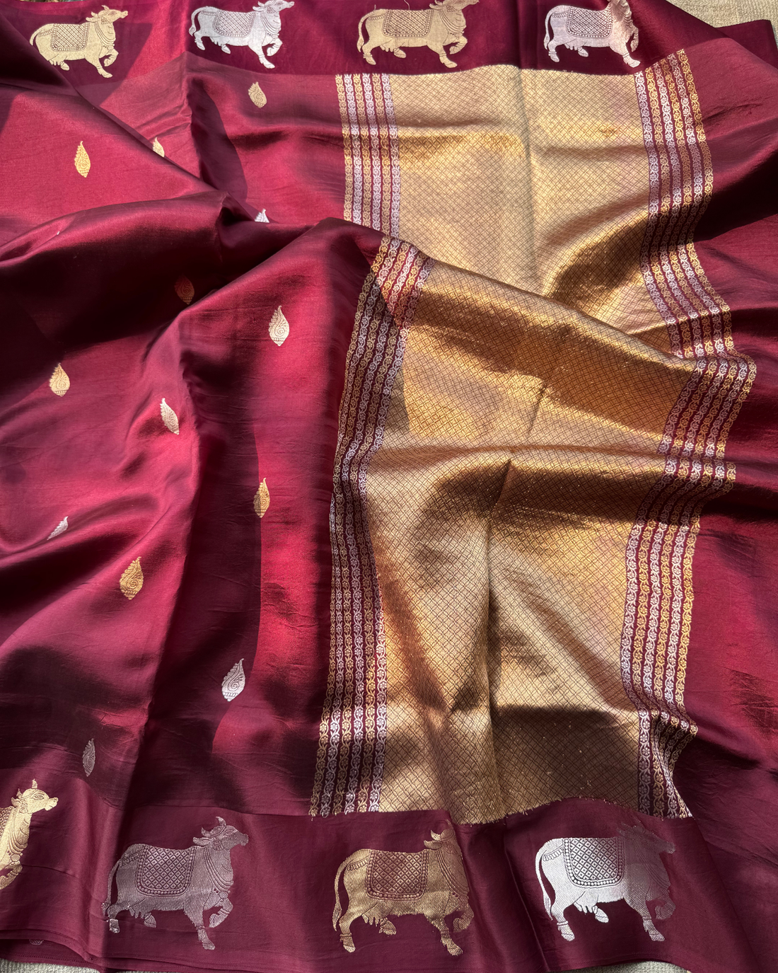 Delicate Shankh bootas on wine pure Mulberry soft silk saree close-up