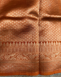 Handloom fabric texture and sheen of dusty orange pure Mulberry silk saree
