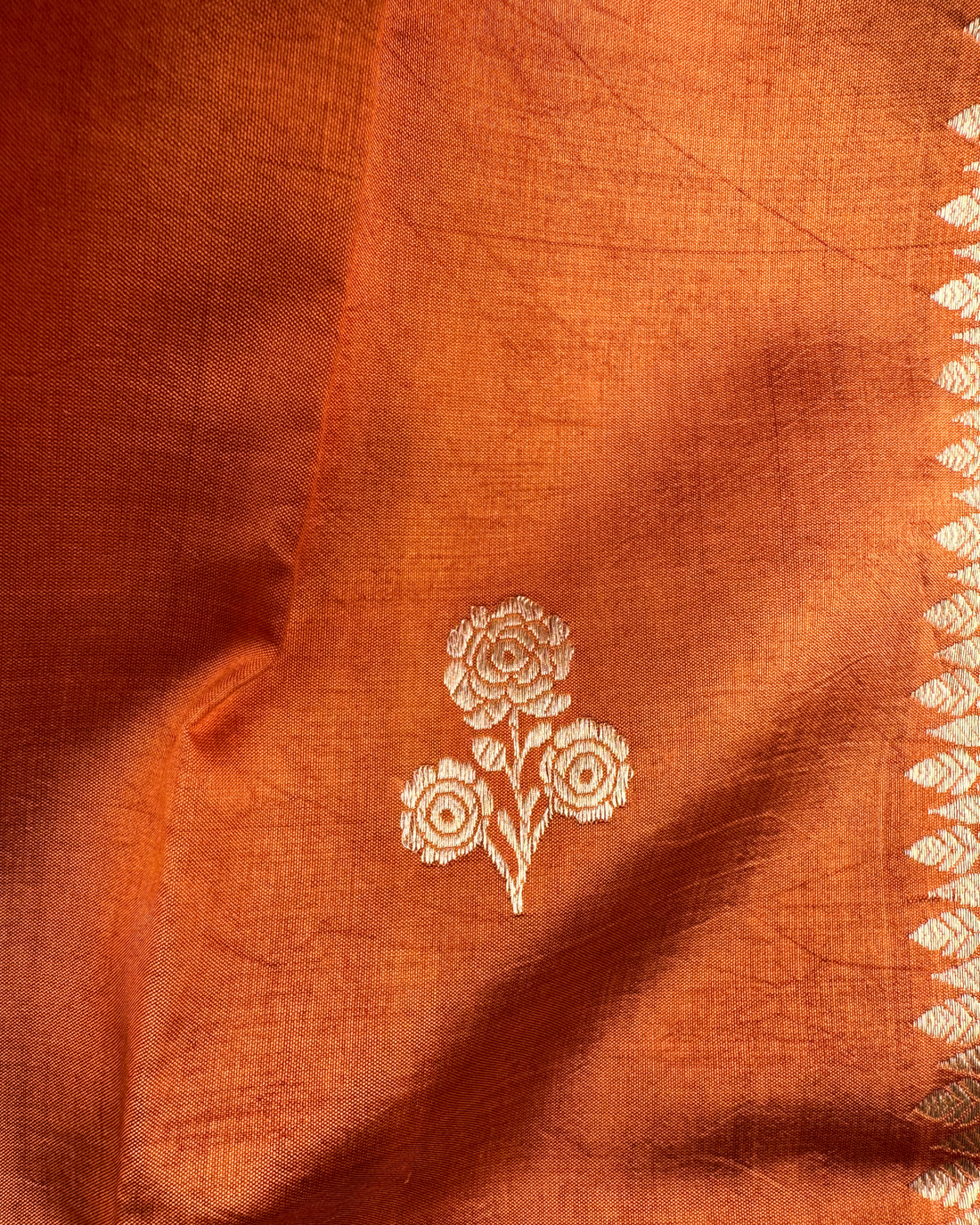 Artisan craftsmanship detail on dusty orange Mulberry soft silk saree