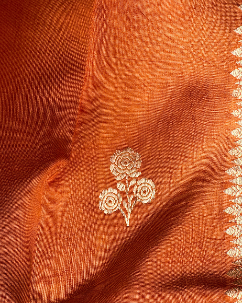 Artisan craftsmanship detail on dusty orange Mulberry soft silk saree