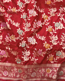 Radiant zari border and intricate motifs on red bridal Banarasi saree