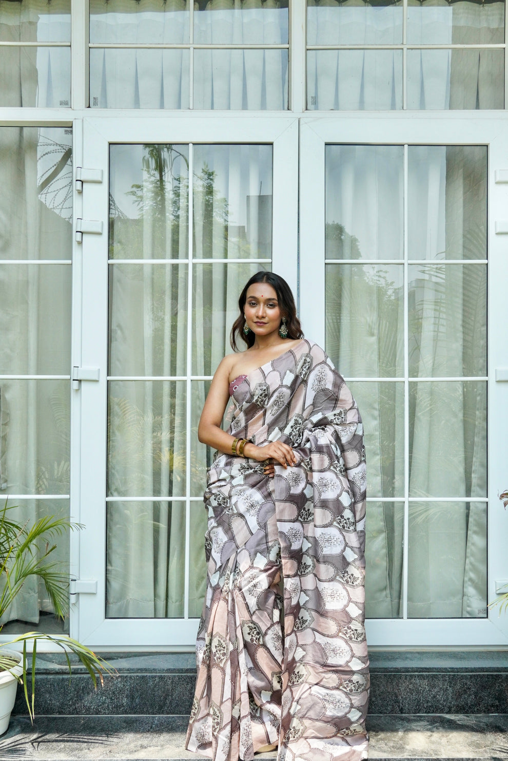Graceful drape of peach-pink pure silk digital print designer saree