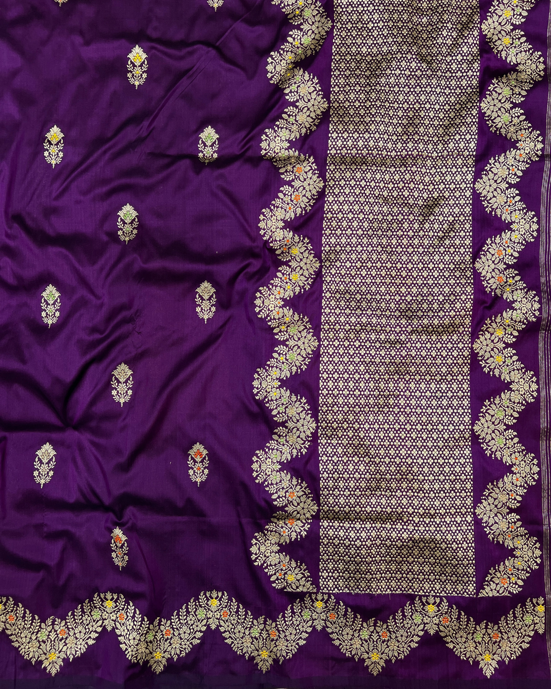 Intricate silver accent detailing on purple handloom silk saree