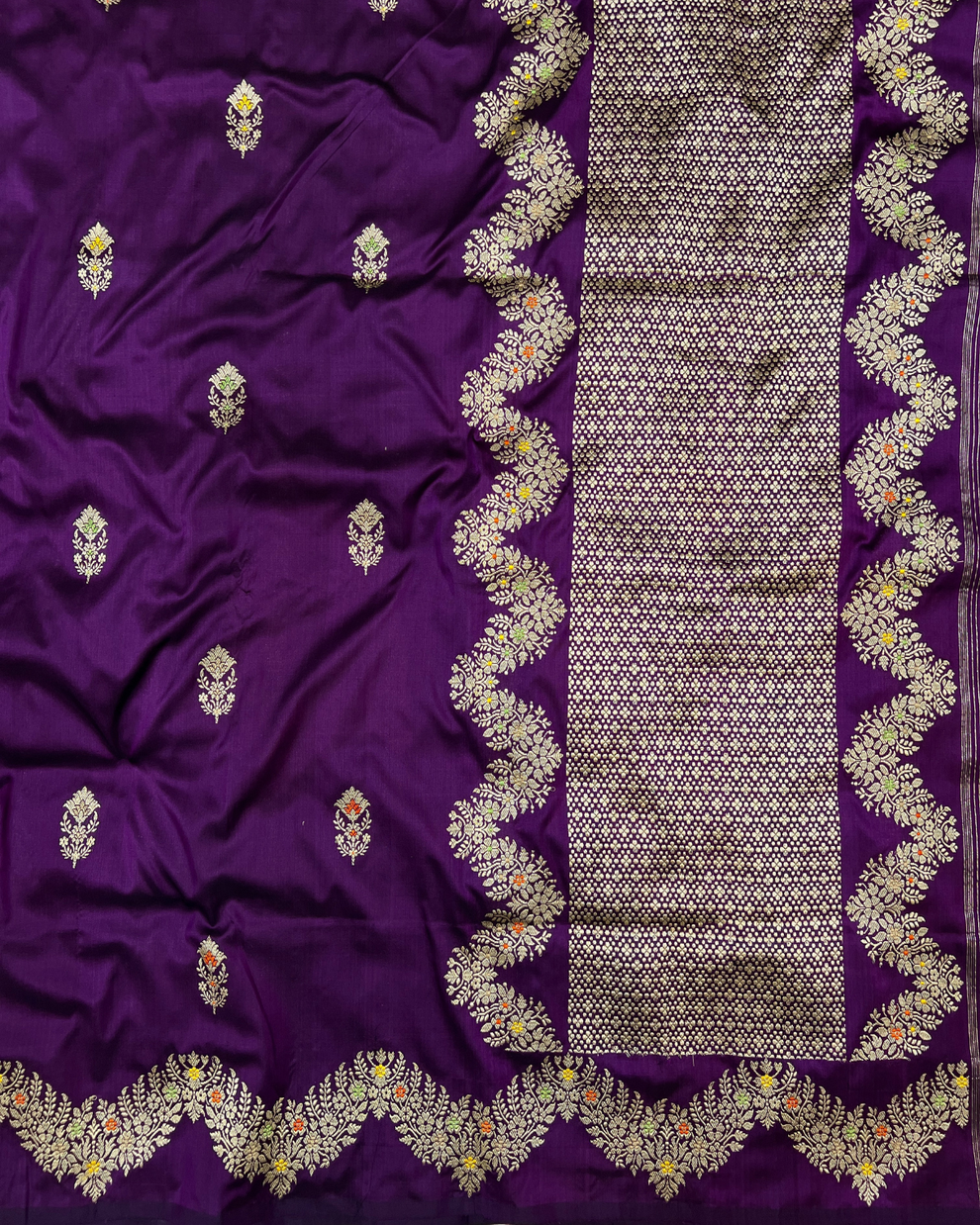 Intricate silver accent detailing on purple handloom silk saree