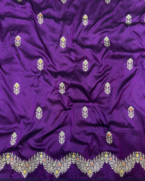 Detailed handwoven pallu on purple pure Banarasi Katan saree
