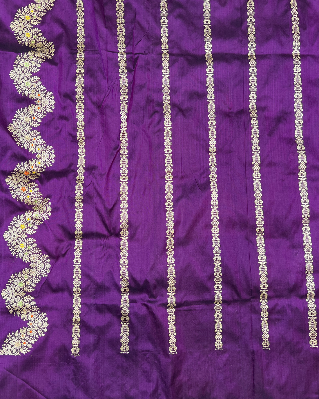 Graceful drape of purple handloom Banarasi Katan boota saree