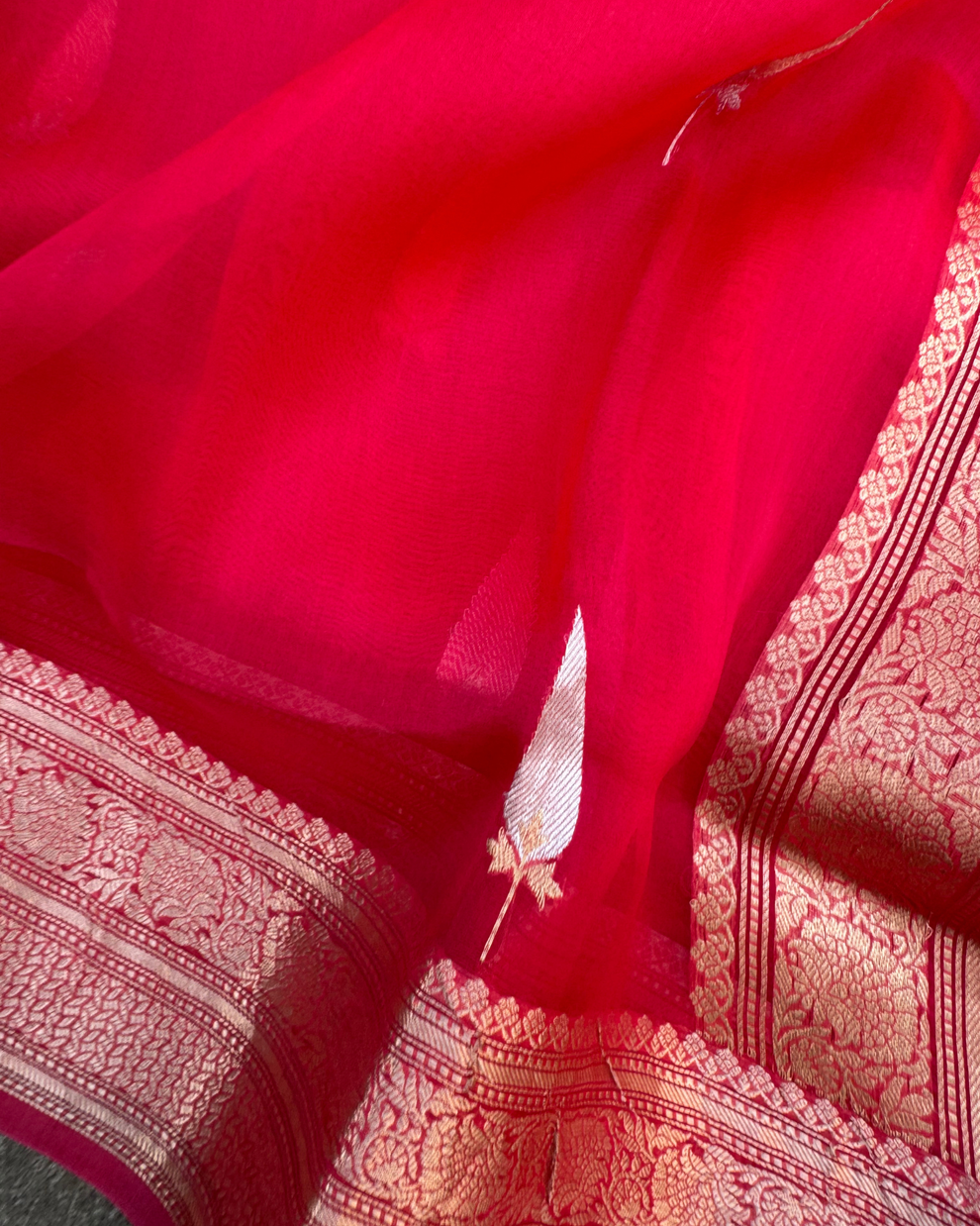 Artisan handloom Kadwa weaving on red and peach pure Kora silk saree