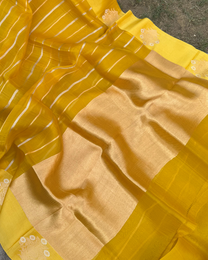 Delicate zari border on yellow pure Kora silk handloom Banarasi saree