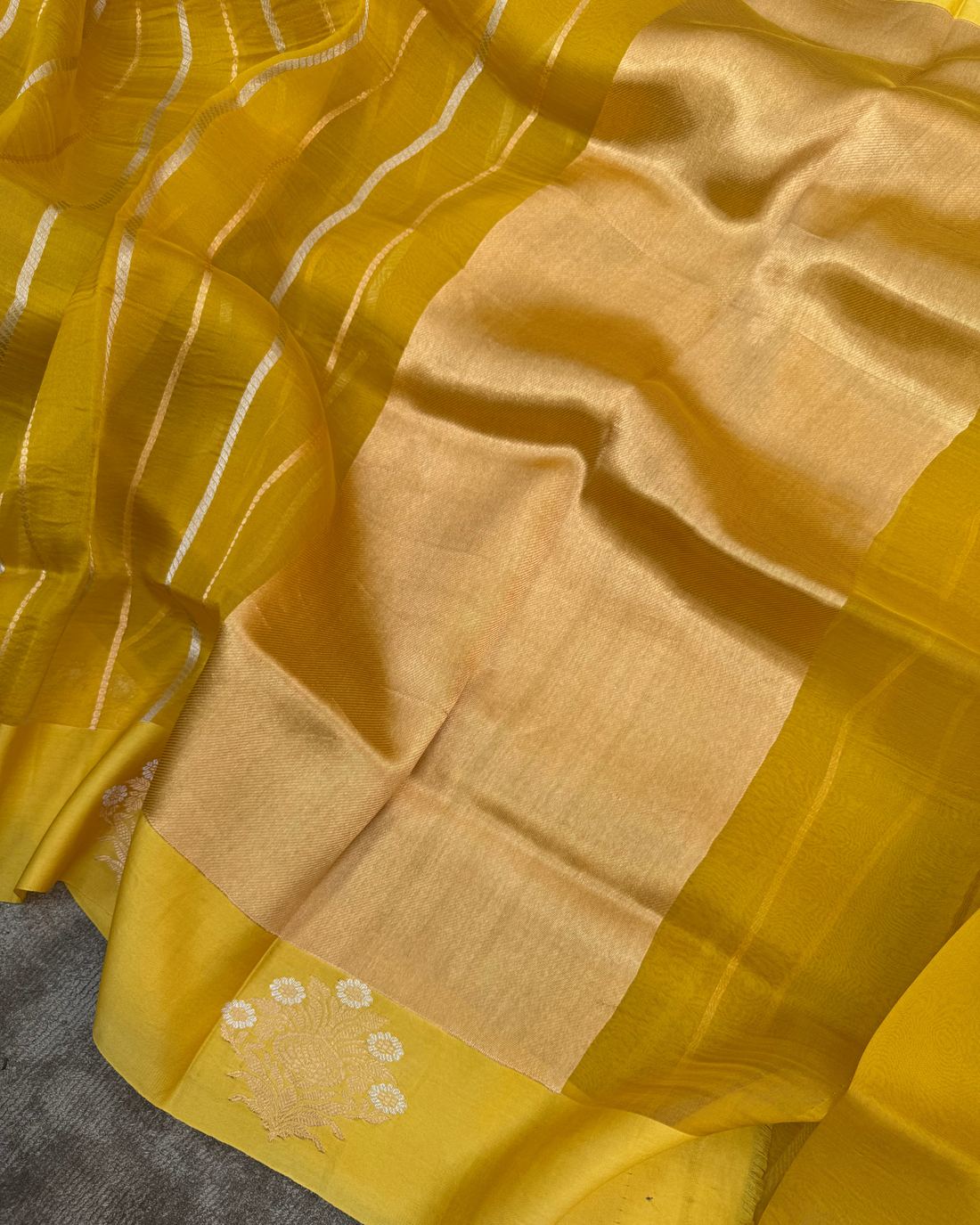 Authentic Kadwa weave craftsmanship on yellow pure Kora silk saree pallu