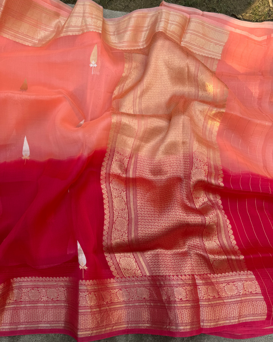 Graceful lightweight drape view of red and peach Banarasi Kora silk saree