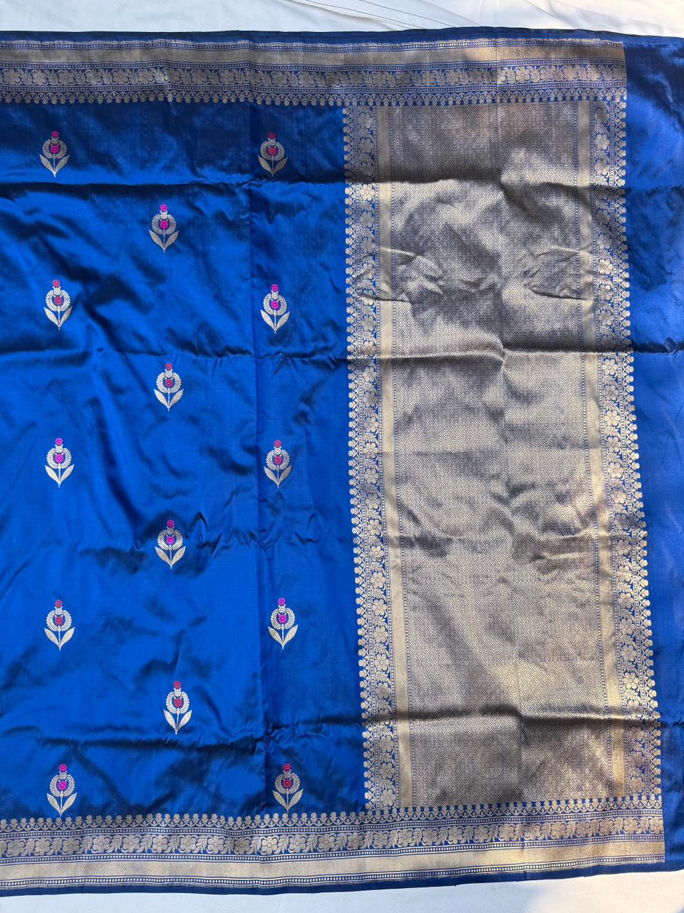 Intricate Kadwa Meenakari boota motifs on blue pure Katan silk saree