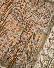 Close-up of intricate jacquard weave patterns on Jamawar Tanchui silk