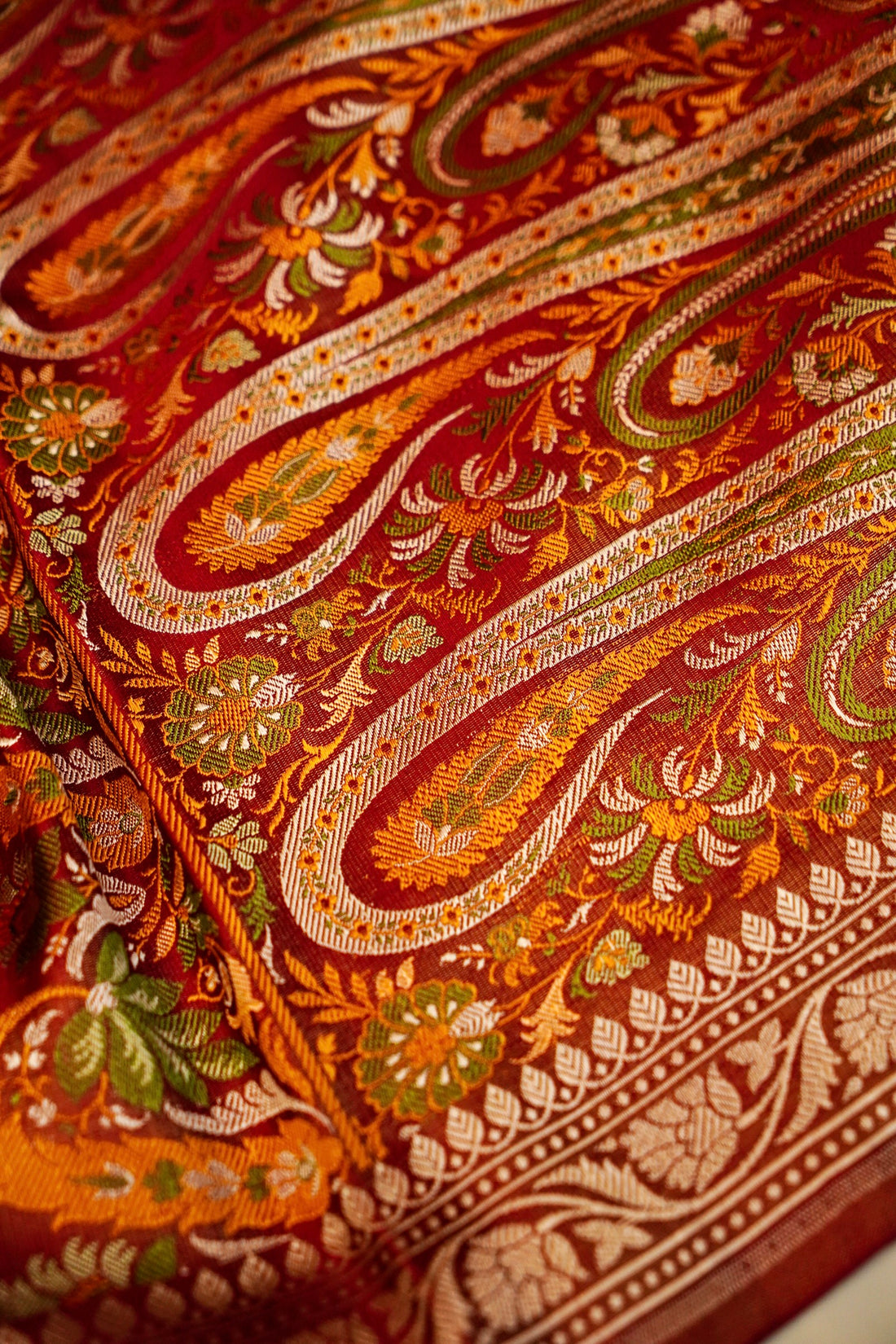 Rich handwoven pallu on red pure Banarasi Mashru silk saree
