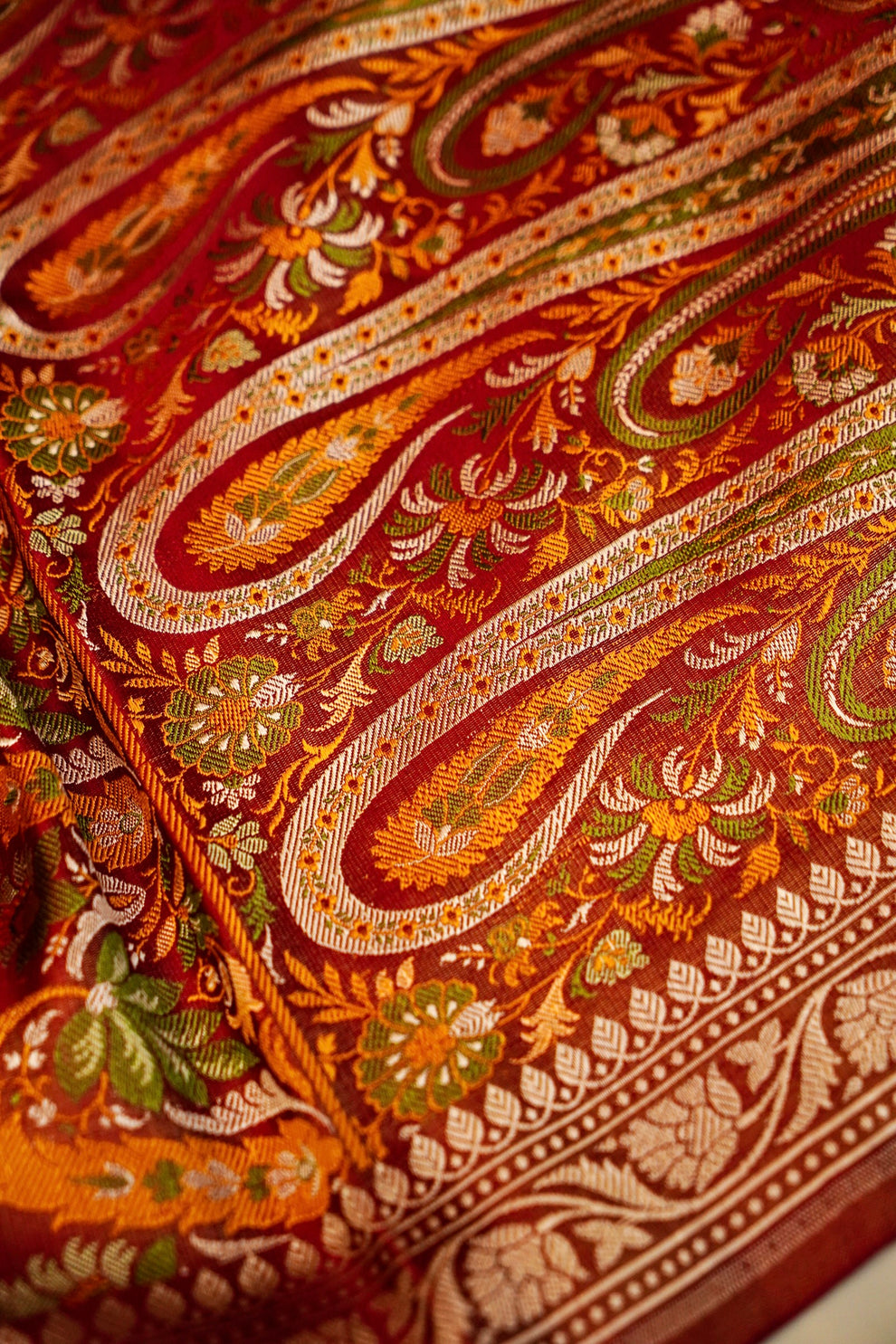 Rich handwoven pallu on red pure Banarasi Mashru silk saree