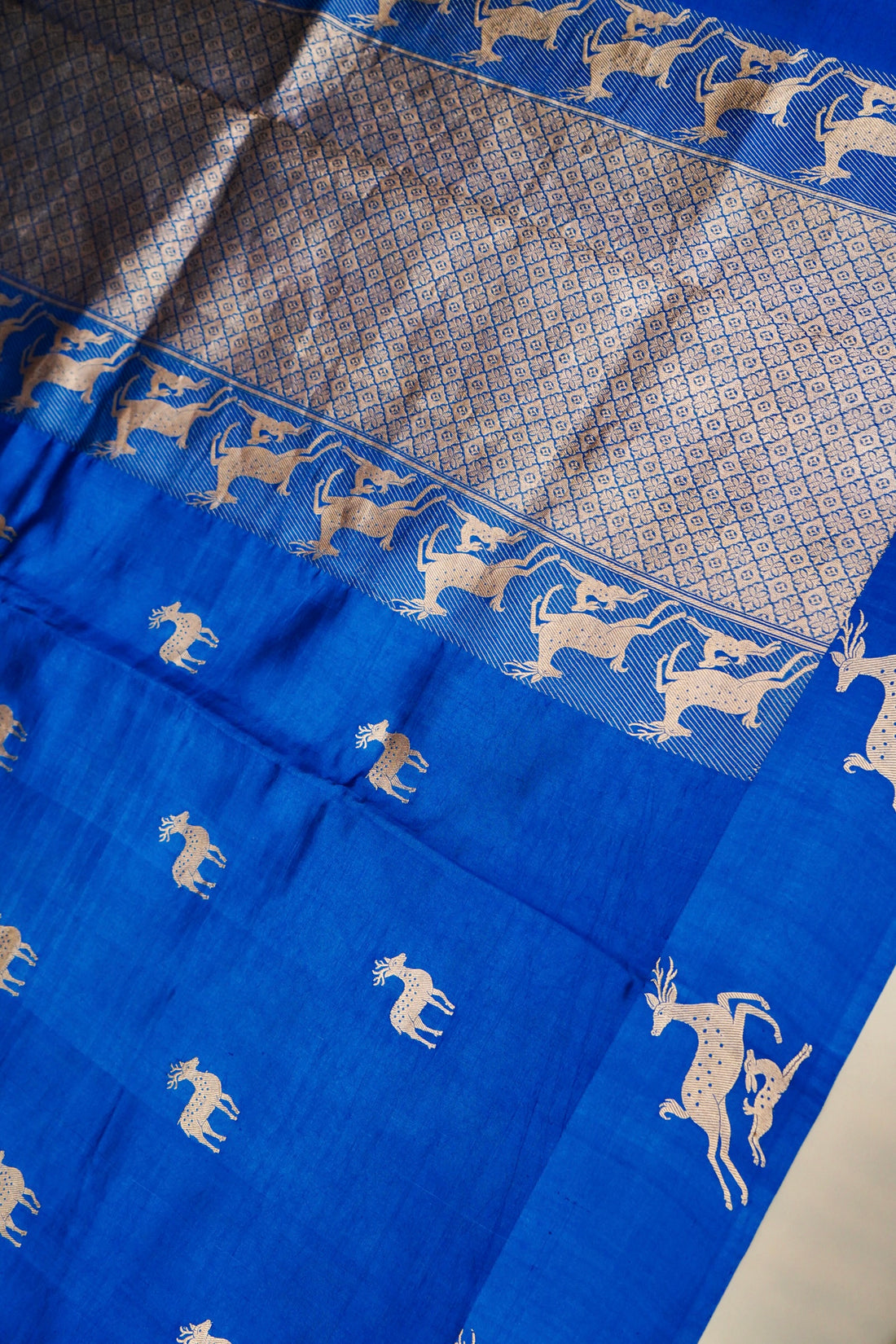 Deer motifs in Kadhua weave on blue pure Mulberry Katan silk saree close-up