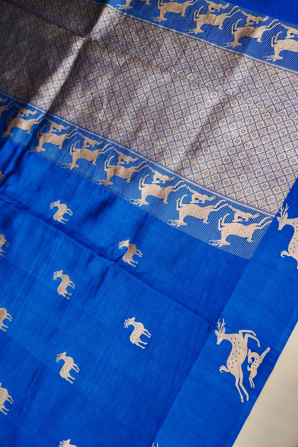 Deer motifs in Kadhua weave on blue pure Mulberry Katan silk saree close-up